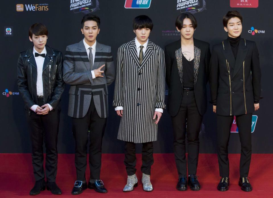 South Korean boy band Winner pose on the red carpet as they attend the 2014 Mnet Asian Music Awards (MAMA) in Hong Kong