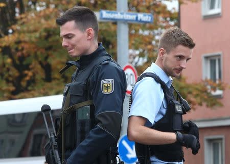 German police officers guard the site where earlier a man injured several people in a knife attack in Munich, Germany, October 21, 2017. REUTERS/Michael Dalder