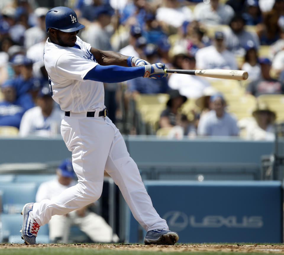 Los Angeles Dodgers' Yasiel Puig hits his second two-run home run of the game, against the San Diego Padres during the fourth inning of a baseball game in Los Angeles, Thursday, April 6, 2017. (AP Photo/Alex Gallardo)