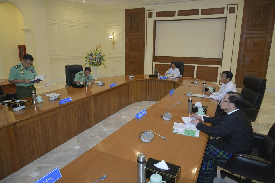 In this photo released from the The Military True News Information Team, Vice Senior Gen. Soe Win, left, deputy chairman of State Administration Council, speaks during a meeting with members the National Defense and Security Council including from left Senior Gen. Min Aung Hlaing, Myint Swe, Pro Temporary President of the military government, Vice President Henry Van Thio, and T Khun Myat, speaker of Union Parliament, Monday, July 31, 2023, in Naypyitaw, Myanmar. Myanmar’s military-controlled government has extended the state of emergency it imposed when the army seized power from an elected government 2 1/2 years ago, forcing a further delay in elections it promised when it took over. (The Military True News Information Team via AP)