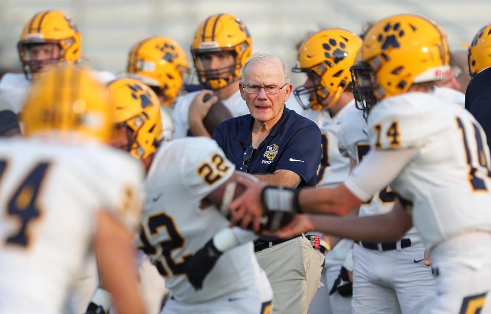 St. Ignatius football coach Chuck Kyle watches his team warmup before a high school football game against the Archbishop Hoban Knights, Friday, Sept. 16, 2022, in Akron, Ohio.