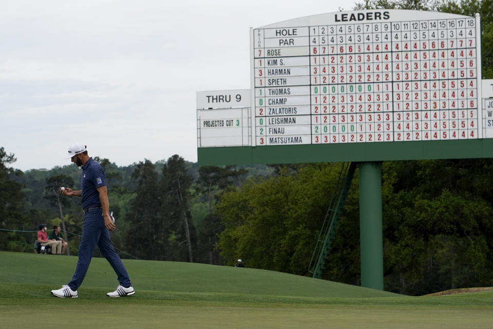 Dustin Johnson walks off the 18th green after his second round in the Masters golf tournament on Friday, April 9, 2021, in Augusta, Ga. (AP Photo/David J. Phillip)