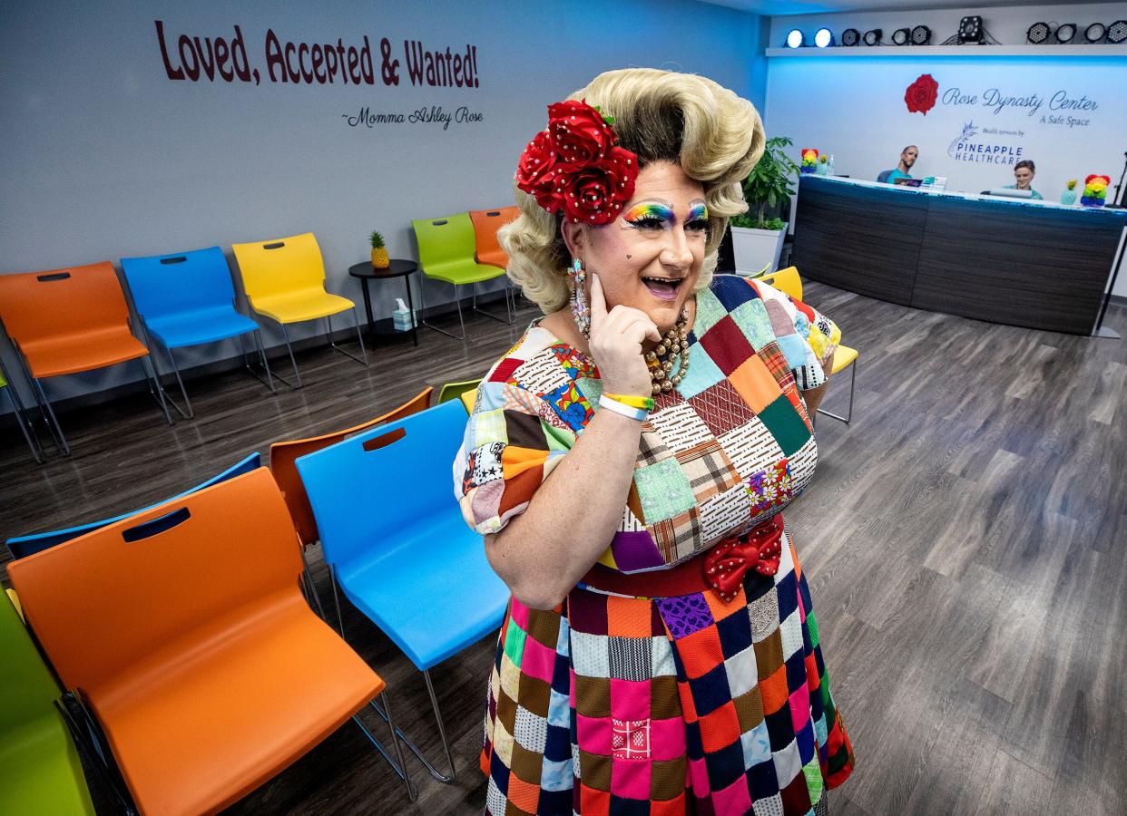 Jason DeShazo, appearing in the drag persona of Momma Ashley Rose, stands in the reception room at the Rose Dynasty Center in Lakeland. The facility, which holds a grand opening on Sunday, will provide a "one-stop shop" for medical care, STI testing, counseling and support groups for the LGBTQ population.