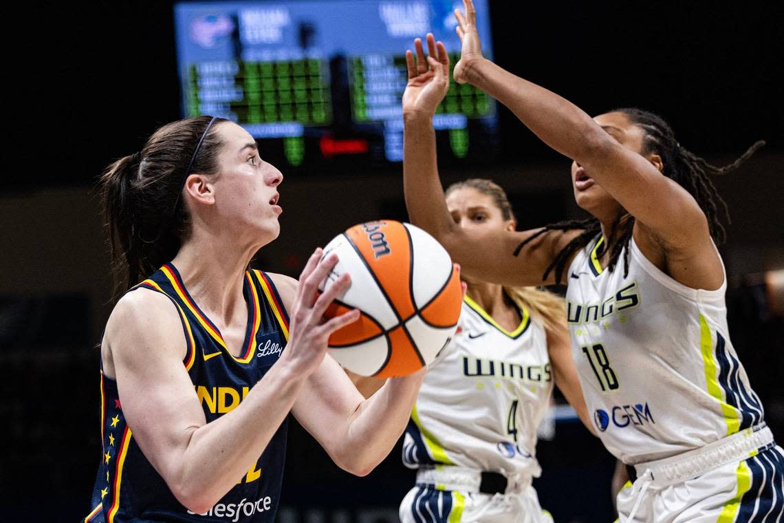 Indiana Fever guard Caitlin Clark (22) attempts to shoot the game-tying, three-point shot at the end of the fourth quarter of a WNBA preseason game between the Dallas Wings and Indiana Fever at College Park Center in Arlington on Friday, May 3, 2024.