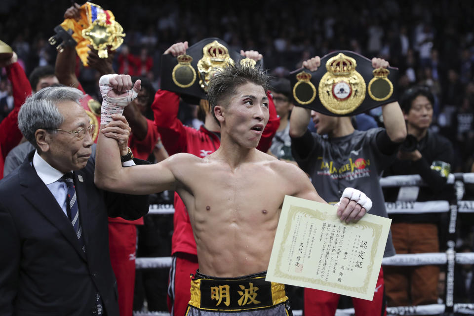 Japan's Naoya Inoue is congratulated after winning the World Boxing Super Series bantamweight final match in Saitama, Japan, Thursday, Nov. 7, 2019. Inoue beat Philippines' Nonito Donaire with a unanimous decision to win the championship. (AP Photo/Toru Takahashi)