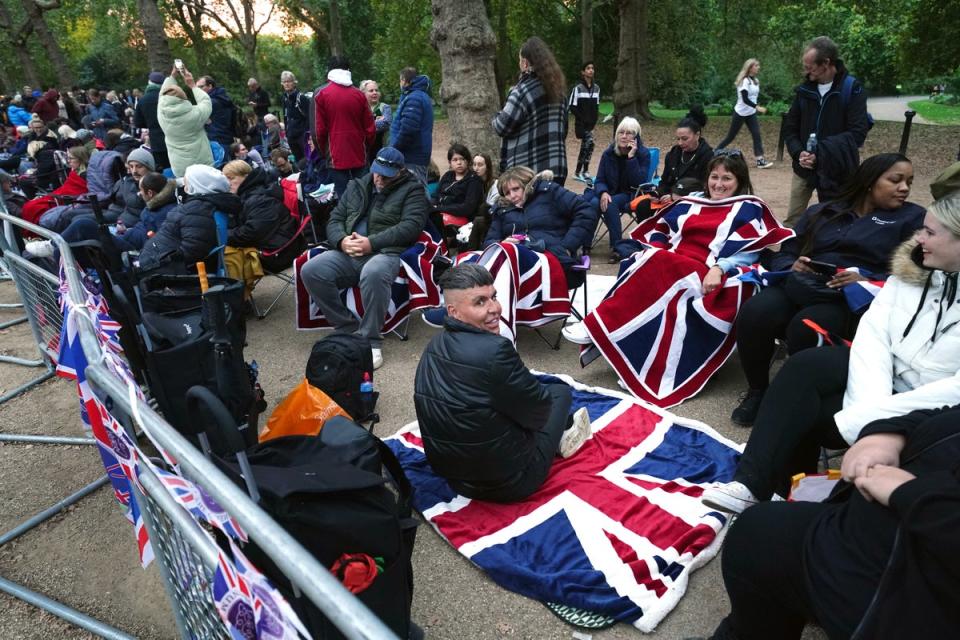 Members of the public in The Mall, central London ahead of Queen Elizabeth II state funeral (PA)