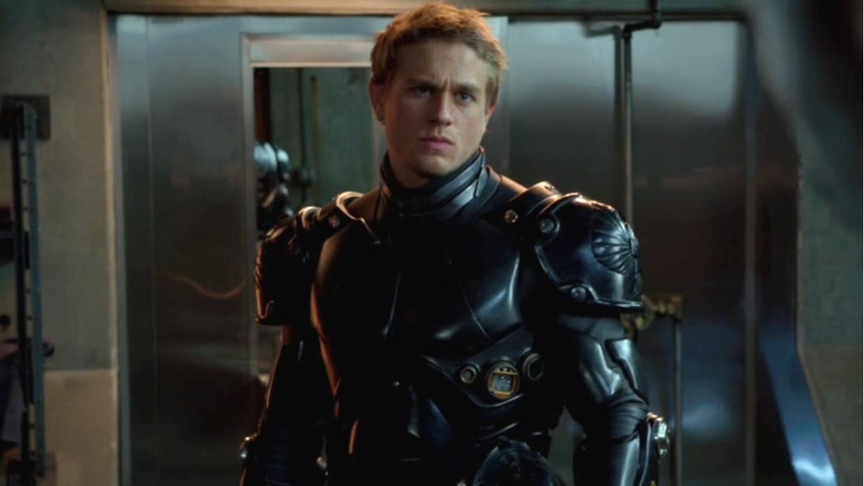  Charlie Hunnam stands dressed in his jaeger suit in Pacific Rim. 