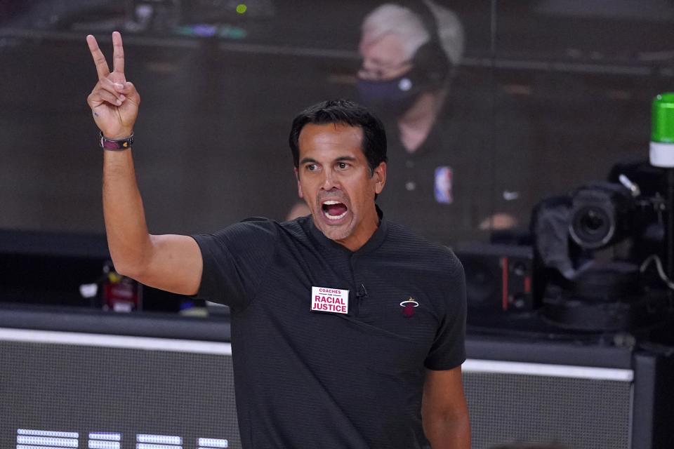 Miami Heat head coach Erik Spoelstra gestures as he watches play against the Boston Celtics during the second half of an NBA conference final playoff basketball game, Thursday, Sept. 17, 2020, in Lake Buena Vista, Fla. (AP Photo/Mark J. Terrill)