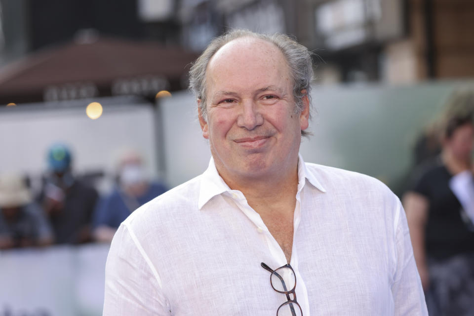 FILE - Hans Zimmer poses for photographers upon arrival for the screening of the film 'Thirteen Lives' in London, Monday, July 18, 2022. When the Seattle Kraken decided to revamp the thematic elements of their pregame introduction during the offseason, Hollywood filmmaker Jerry Bruckheimer, part of the Kraken ownership group, said he had a friend who might be willing to do a favor and provide a grandiose soundtrack of music building to a crescendo as the players hit the ice and would accompany the video production. That friend: Grammy and Oscar Award winning composer Hans Zimmer. (Photo by Vianney Le Caer/Invision/AP, File)