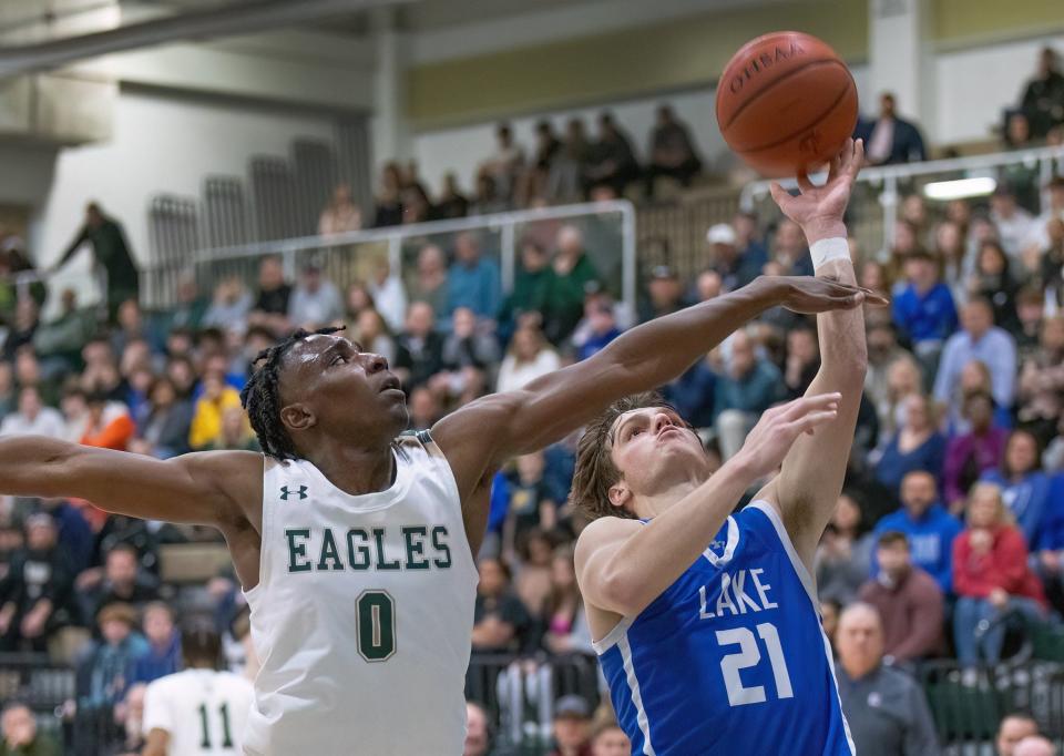 Lake’s Caleb Collins shoots over GlenOak’s Ja’Corey Lipkins in a Division I sectional, Wednesday, Feb. 22, 2023.