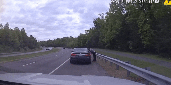 An out of control car goes across the median and crashes into a car pulled over by a police officer in Fairfax County, Va. (Fairfax County Poilce Department/NBC Washington)