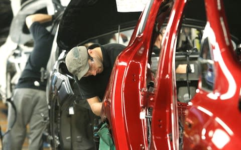 Nissan production line - Credit: Bloomberg