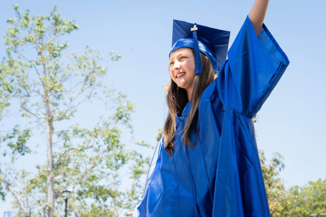 A handout photo of Athena Elling in cap and gown at Irvine Valley College. Elling will be the school's youngest graduate