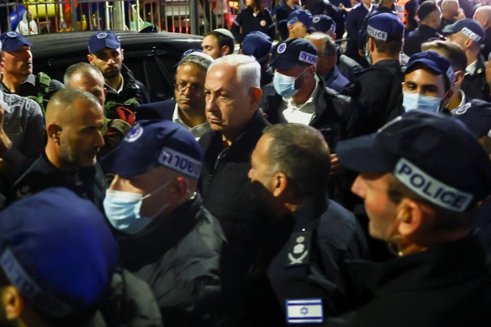 Israeli Prime Minister Benjamin Netanyahu visits the scene (Reuters)