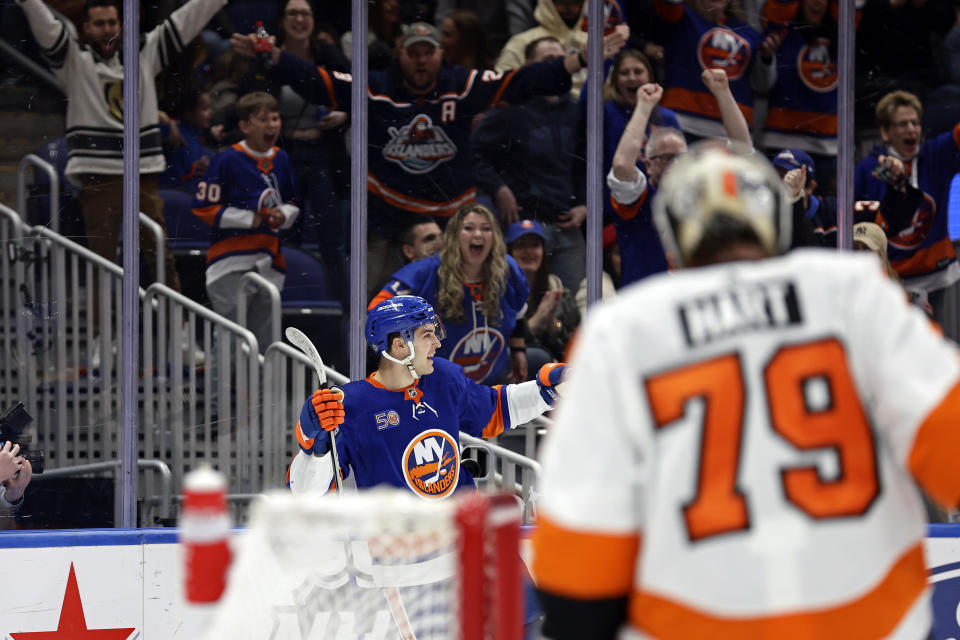 New York Islanders defenseman Samuel Bolduc reacts after scoring a goal past Philadelphia Flyers goaltender Carter Hart in the second period of an NHL hockey game Saturday, April 8, 2023, in Elmont, N.Y. (AP Photo/Adam Hunger)