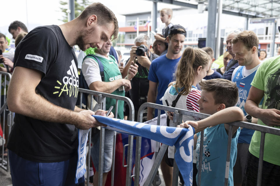 Zoran Dragic of the Slovenian basketball team signs autographs for the fans who greeted the Slovenian basketball team players as they arrive at Ljubljana Airport from the Olympic qualifying tournament in Kaunas Slovenian basketball team arrived at Ljubljana Airport on Monday after qualifying for the summer Olympic games for the first time in history. (Sipa via AP Images)