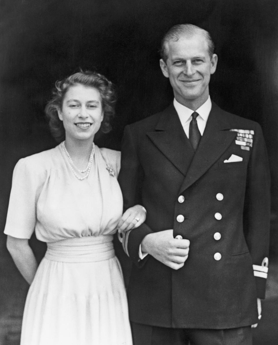 <p>The story behind Queen Elizabeth II’s engagement ring is a real life fairy tale. After falling for Prince Philip aged just thirteen, the pair began to exchange love letters.<br><br>And in 1946, the Duke of Edinburgh asked King George VI for his daughter’s hand in marriage but he could not propose until her 21st birthday. Their engagement was officially announced on 9 July, 1947.<br><br>The Queen’s three-carat engagement ring features ten diamonds and once belonged to the Duke of Edinburgh’s mother, Princess Alice of Battenberg.<br><br>When his late mother learnt that he was wishing to propose, she gave her son the tiara she donned on her wedding day so that it could be dismantled to produce the perfect engagement ring.<br><br>Prince Philip then collaborated on the creation of the ring with London-based jeweller Philip Antrobus and used the additional stones to make a diamond bracelet which he gave the Queen as a wedding gift. <em>[Photo: Getty]</em> </p>