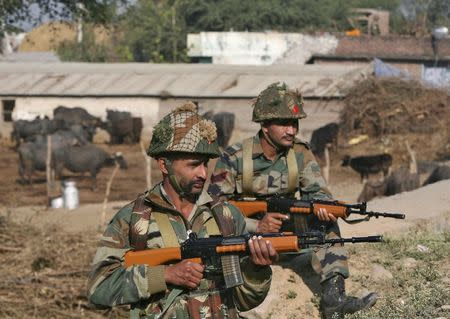 Indian army soldiers stand guard near the Indian Air Force (IAF) base at Pathankot in Punjab, India, January 3, 2016. REUTERS/Mukesh Gupta