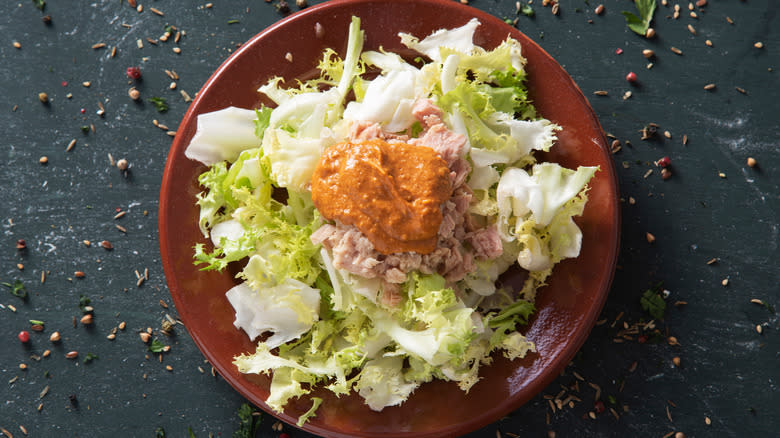 Spanish romesco sauce on salad in bowl