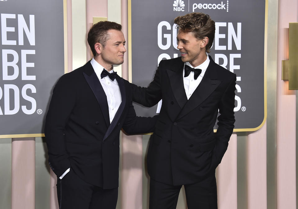 Taron Egerton, left, and Austin Butler arrive at the 80th annual Golden Globe Awards at the Beverly Hilton Hotel on Tuesday, Jan. 10, 2023, in Beverly Hills, Calif. (Photo by Jordan Strauss/Invision/AP)