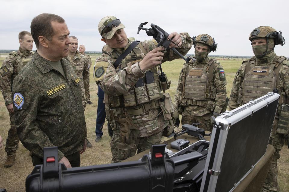 Russian Security Council Deputy Chairman and the head of the United Russia party Dmitry Medvedev, left, visits the Prudboy military training ground in the Volgograd region of Russia on Thursday, June 1, 2023. Analysts say Moscow has learned from its mistakes so far in Ukraine and has improved its weapons and skills. (Ekaterina Shtukina/Pool Photo via AP, File)