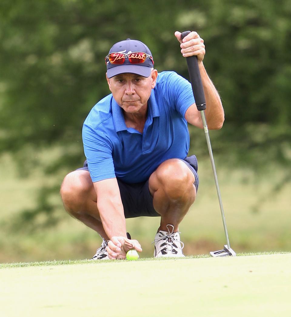 Dan Neubecker lines up his putt on the first green during the Super Senior portion of the City Golf Qualifying Tournament at Cascades Golf Course on Saturday, June 25, 2022. He had the day's best round of 67.