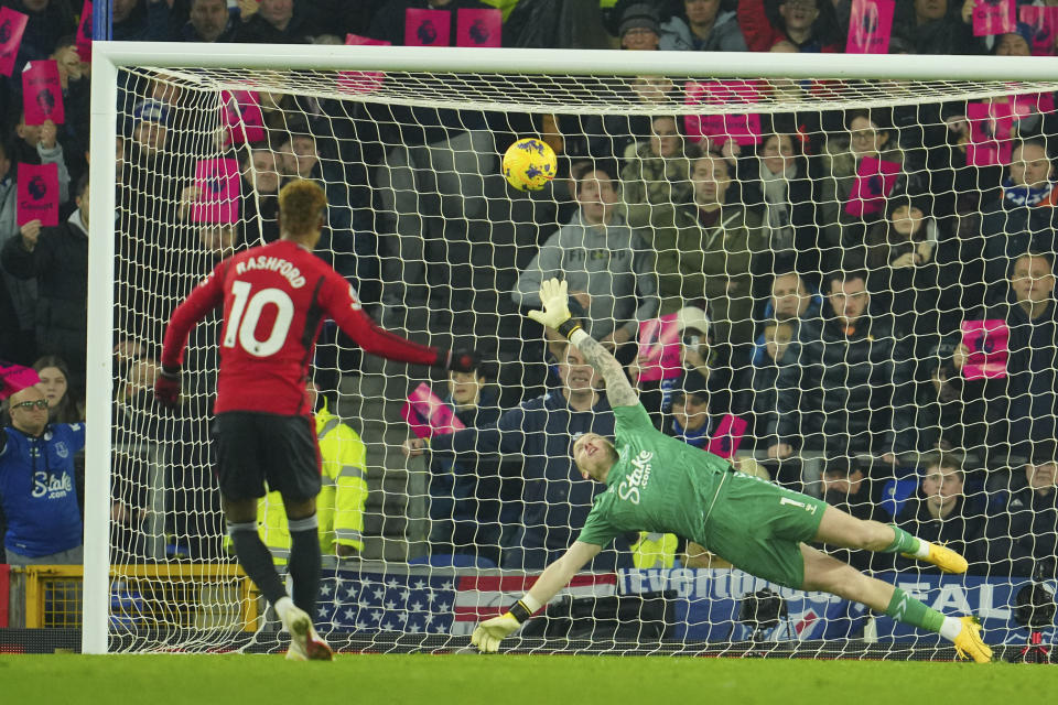 Manchester United's Marcus Rashford scores his side's second goal on a penalty kick during the English Premier League soccer match between Everton and Manchester United, at Goodison Park Stadium, in Liverpool, England, Sunday , Nov. 26, 2023. (AP Photo/Jon Super)