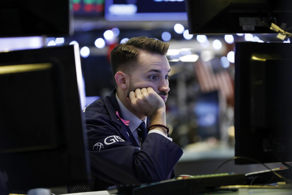 Specialist Matthew Greiner works at his post on the floor of the New York Stock Exchange, Thursday, Dec. 27, 2018. Wall Street's wild Christmas week goes on, with the Dow Jones Industrial Average slumping 300 points at the open Thursday, a day after notching its biggest-ever point gain. (AP Photo/Richard Drew)