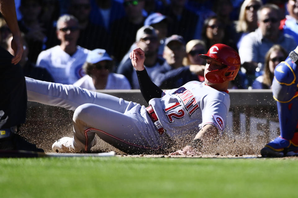 Cincinnati Reds' Spencer Steer scores against the Chicago Cubs during the third inning of a baseball game, in Chicago, Saturday, Oct. 1, 2022. (AP Photo/Matt Marton)