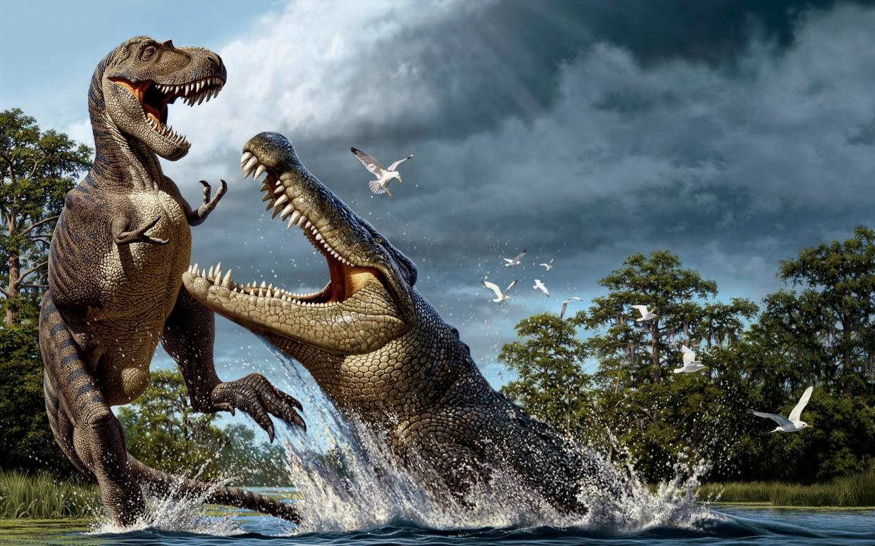 An illustration of a Deinosuchus lunging at an Albertosaurus - National Geographic / Bridgeman Images/Martin, Raul D.