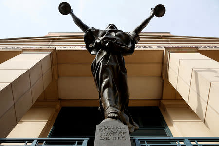 FILE PHOTO: The statue of Lady Justice stands at the Federal Courthouse in Alexandria, Virginia, U.S., August 17, 2018. REUTERS/Joshua Roberts/File Photo