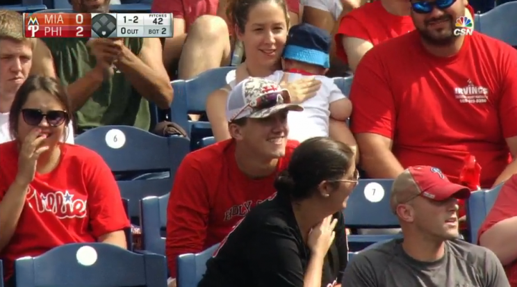 Phillies fan smiles after his amazing foul catch. (MLB.TV)