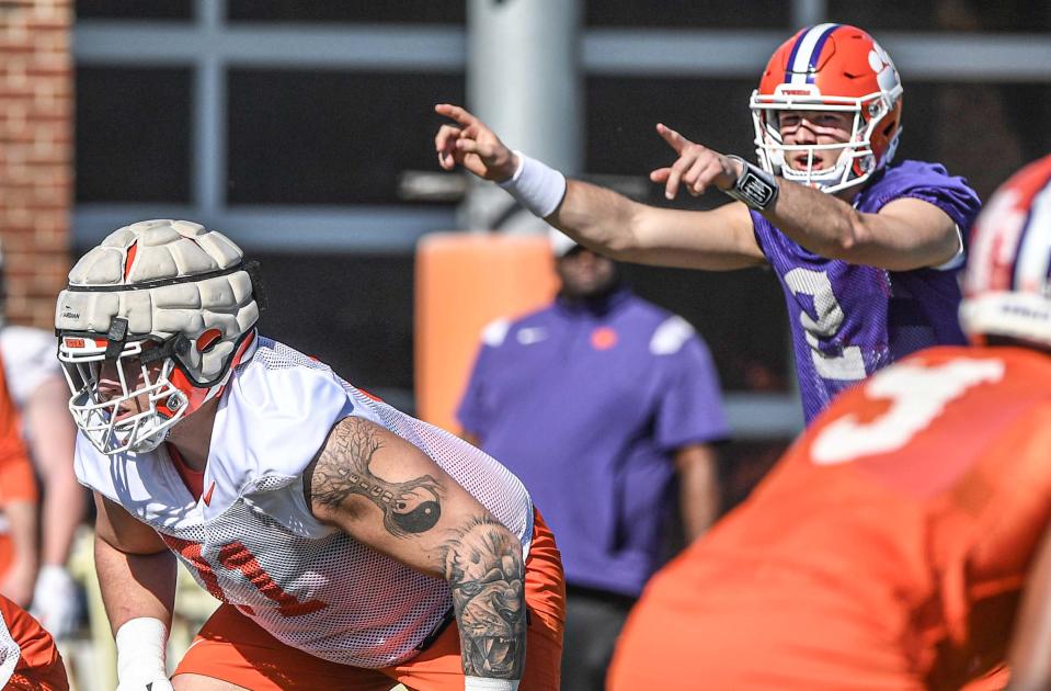 Clemson quarterback Cade Klubnik (2) calls a play near Clemson offensive lineman Tristan Leigh (71) during the second day of spring practice at the football Complex in Clemson, SC Tuesday, March 7, 2023.
