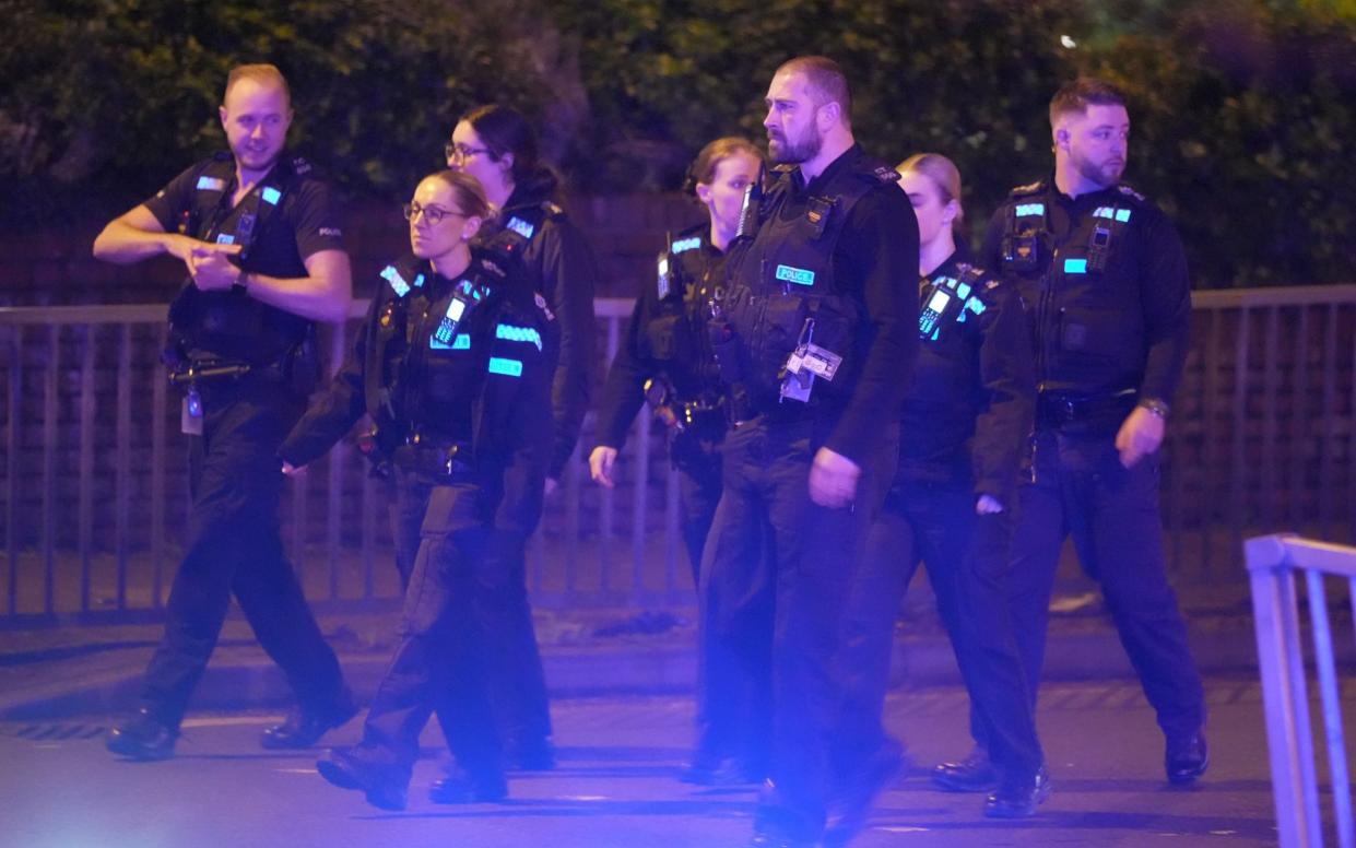 Police move in to try to restore order outside the house