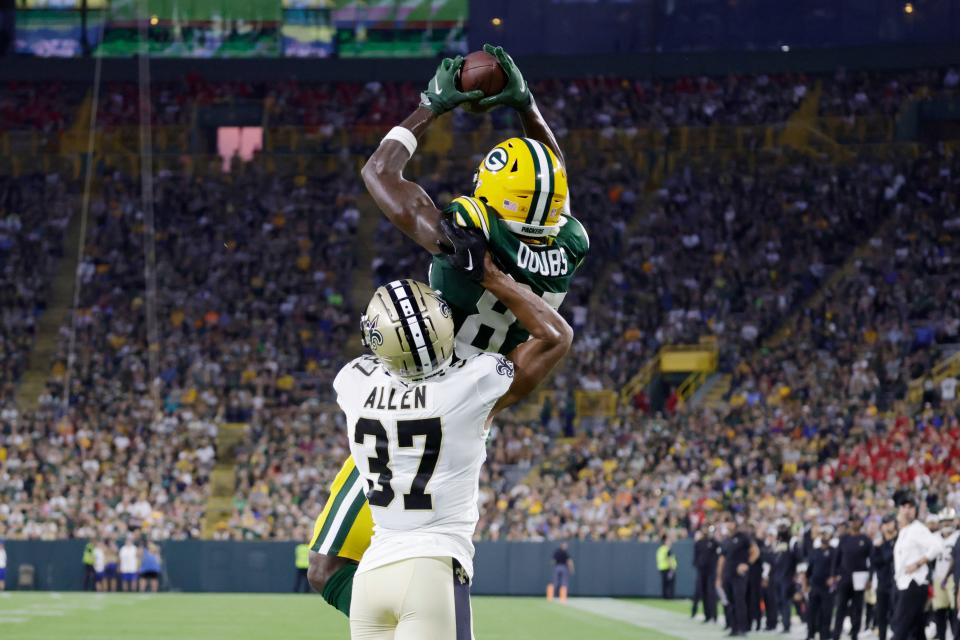 Green Bay Packers wide receiver Romeo Doubs pulls in a touchdown pass over New Orleans Saints cornerback Brian Allen during the first half of a preseason game on Aug. 19, 2022, in Green Bay.