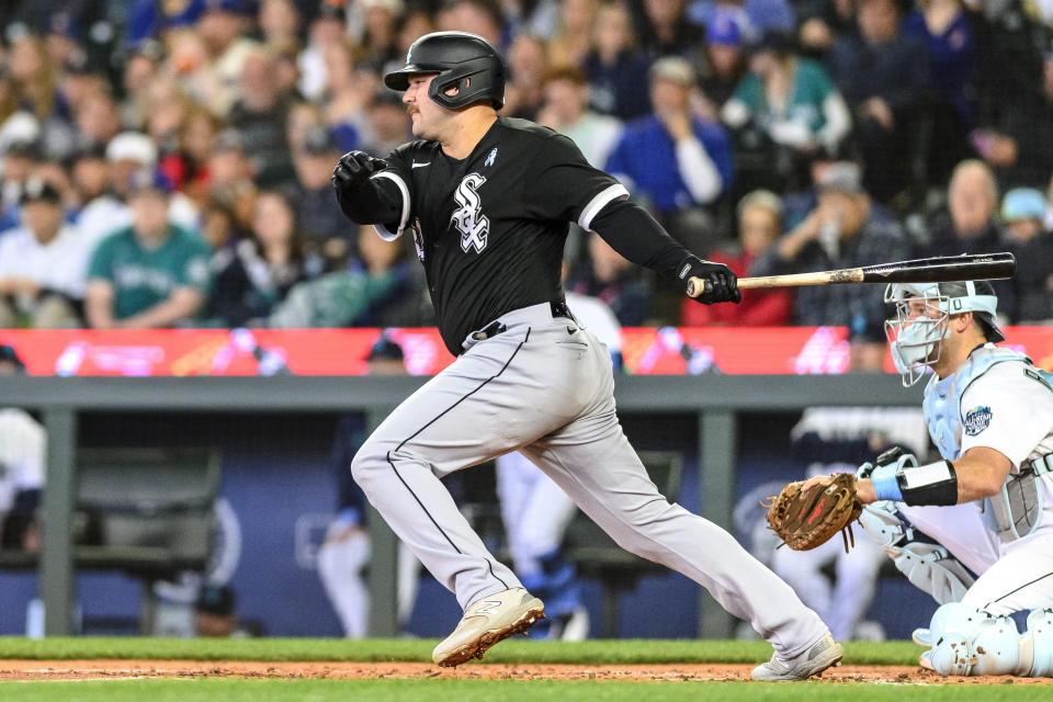 Chicago White Sox's Jake Burger hits a single against the Seattle Mariners during the third inning of a baseball game, Sunday, June 18, 2023, in Seattle. (AP Photo/Caean Couto)