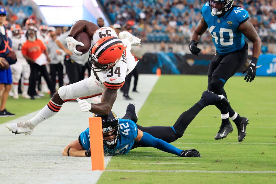 Cleveland Browns running back Jerome Ford #34 is shoved out of bounds by Jacksonville Jaguars safety Andrew Wingard #42 at the 2 yard line during the second quarter of a preseason NFL game Friday, Aug. 12, 2022 at TIAA Bank Field in Jacksonville. 