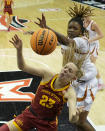 Iowa State guard Kelsey Joens (23) and Texas forward DeYona Gaston (5) compete for a rebound during the first half of an NCAA college basketball game for the Big 12 tournament championship Tuesday, March 12, 2024, in Kansas City, Mo. (AP Photo/Charlie Riedel)