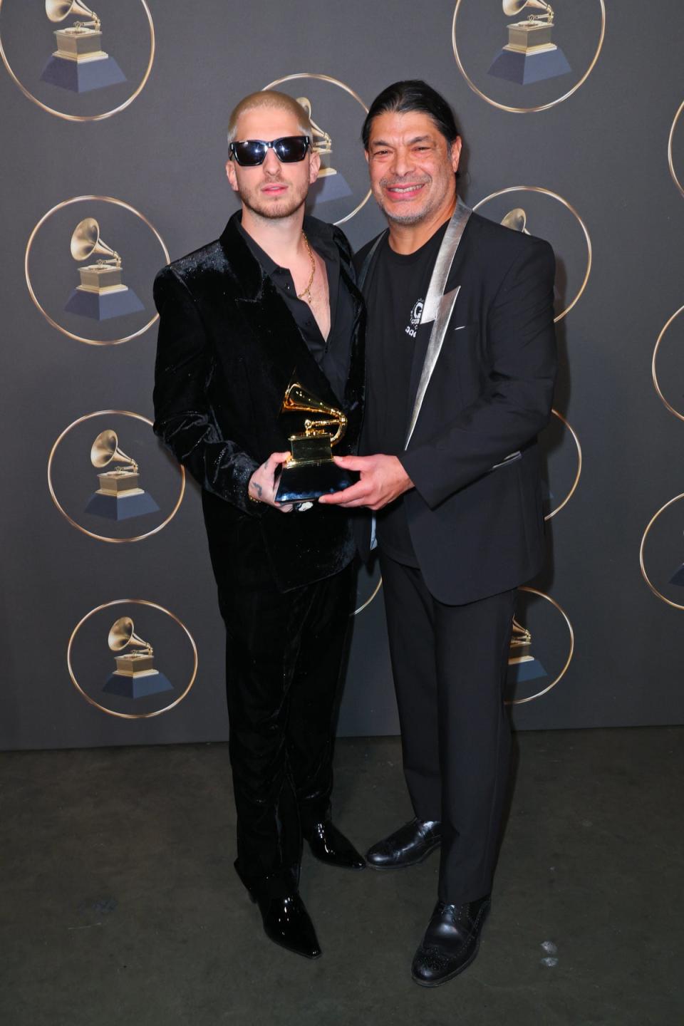 Ozzy Osbourne’s producer Andrew Watt and bass guitarist Robert Trujillo pose with his awards (Getty Images for The Recording A)