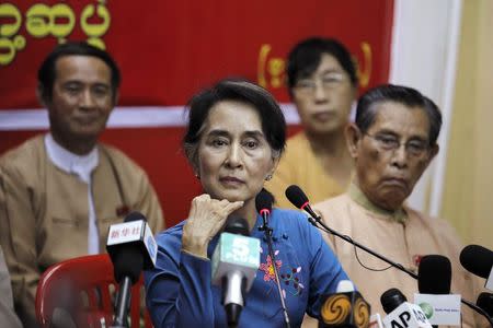 Myanmar's pro-democracy leader Aung San Suu Kyi listens as reporter asks her a question during a news conference at the National League for Democracy party head office in Yangon November 5, 2014. REUTERS/Soe Zeya Tun
