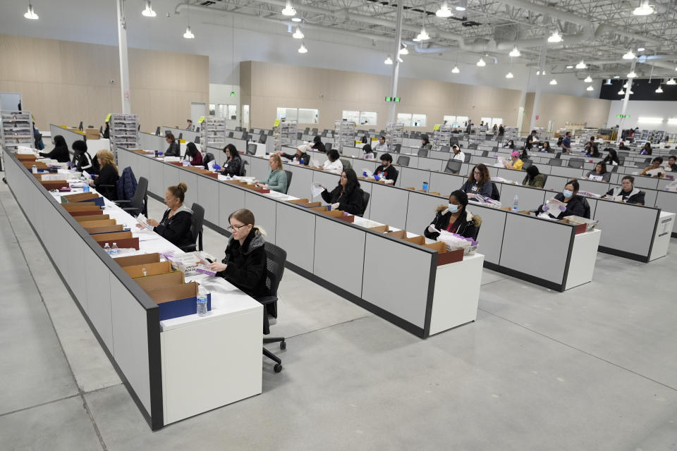 Ballots are inspected at a ballot processing center Tuesday, March 5, 2024, in the City of Industry, Calif. (AP Photo/Marcio Jose Sanchez)