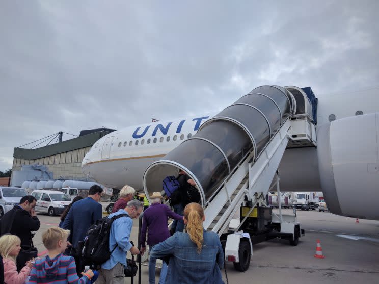 Passengers boarding an airplane.