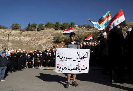 Druze Arabs on the Israeli-occupied Golan Heights hold an anti-election protest outside a municipal polling station in Majdal Shams, October 30, 2018 REUTERS/Ammar Awad