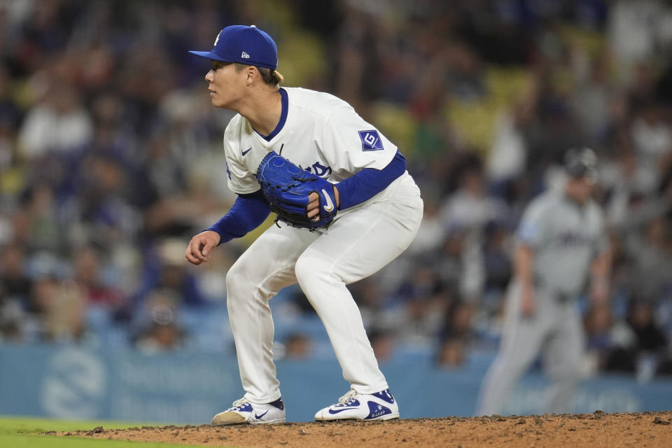 Los Angeles Dodgers pitcher Yoshinobu Yamamoto follows through on a pitch to a Miami Marlins batter during the eighth inning of a baseball game Tuesday, May 7, 2024, in Los Angeles. (AP Photo/Marcio Jose Sanchez)