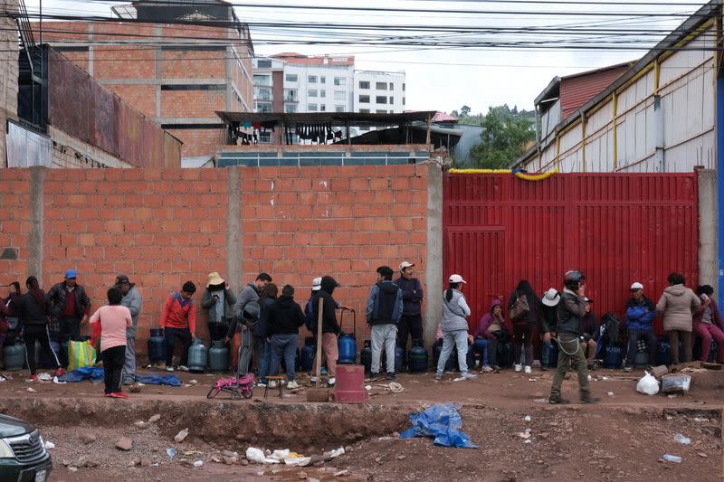 People line up to buy domestic gas after weeks of anti-government protests impacting goods, transport, business and the operation of some key mines, in Cuzco