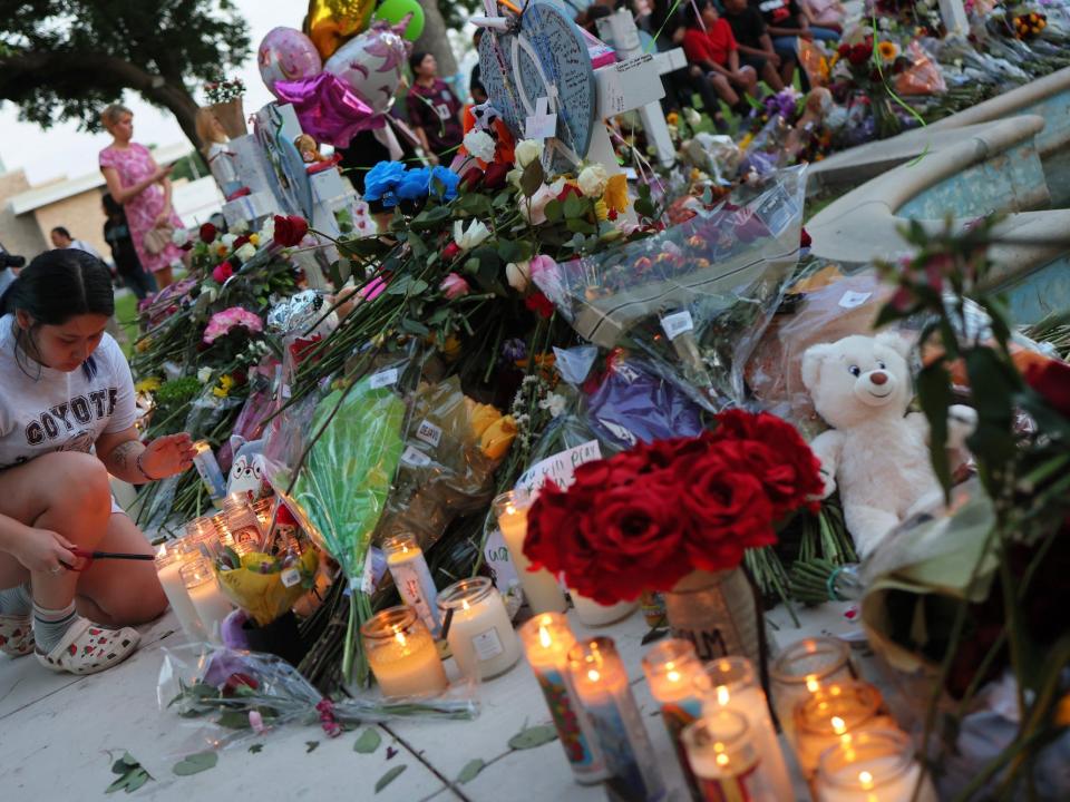 People visit memorials for victims of the May 24th mass shooting on May 27, 2022 in Uvalde, Texas.