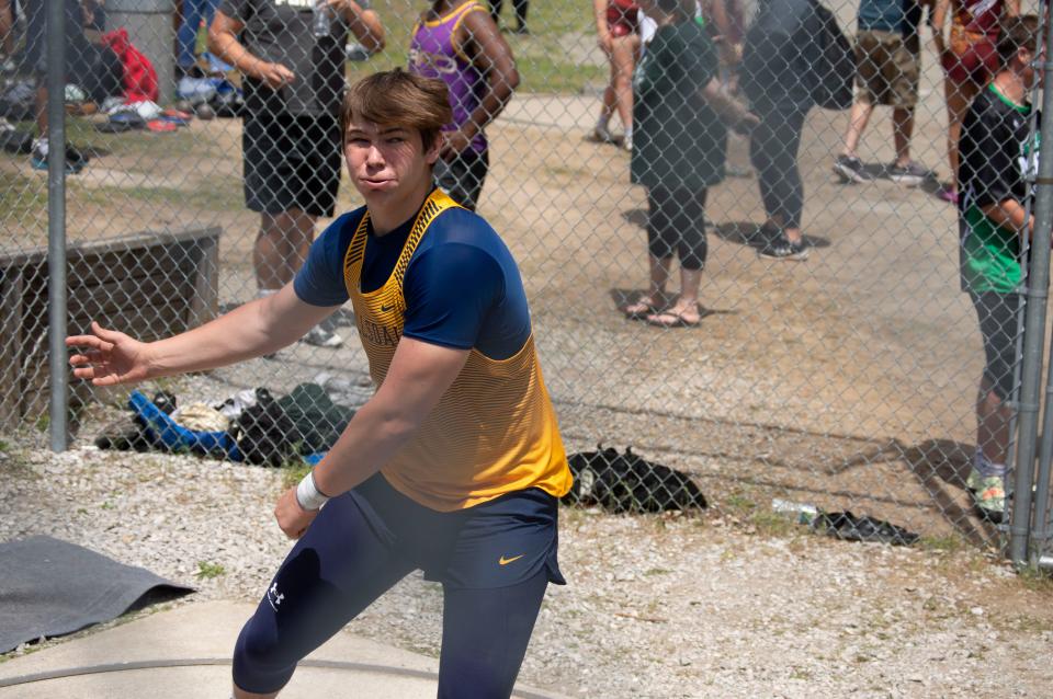 Hornet Shaun McGuire launches a discus at the MITCA D3 team state finals