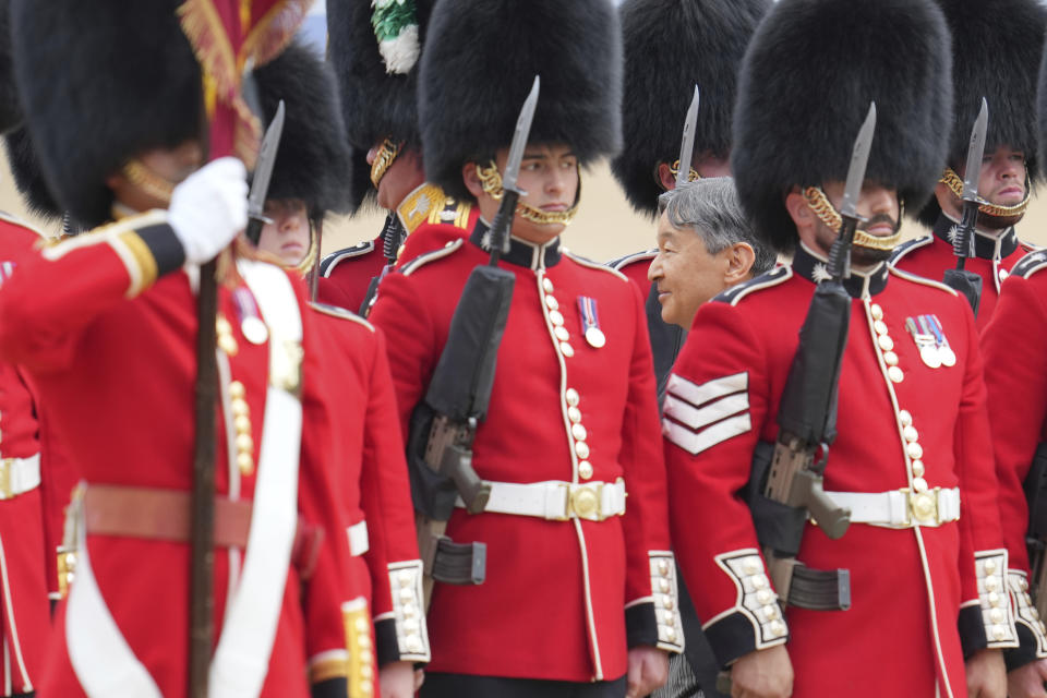 Japans Emperor Naruhito inspects the honour guard on Horse Guards parade during the ceremonial welcome for start of the State Visit to Britain by the Japanese Emperor and Empress, in London, Tuesday, June 25, 2024. (AP Photo/Kin Cheung, Pool)