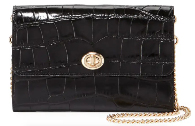 This 135 Coach clutch is the perfect versatile black bag