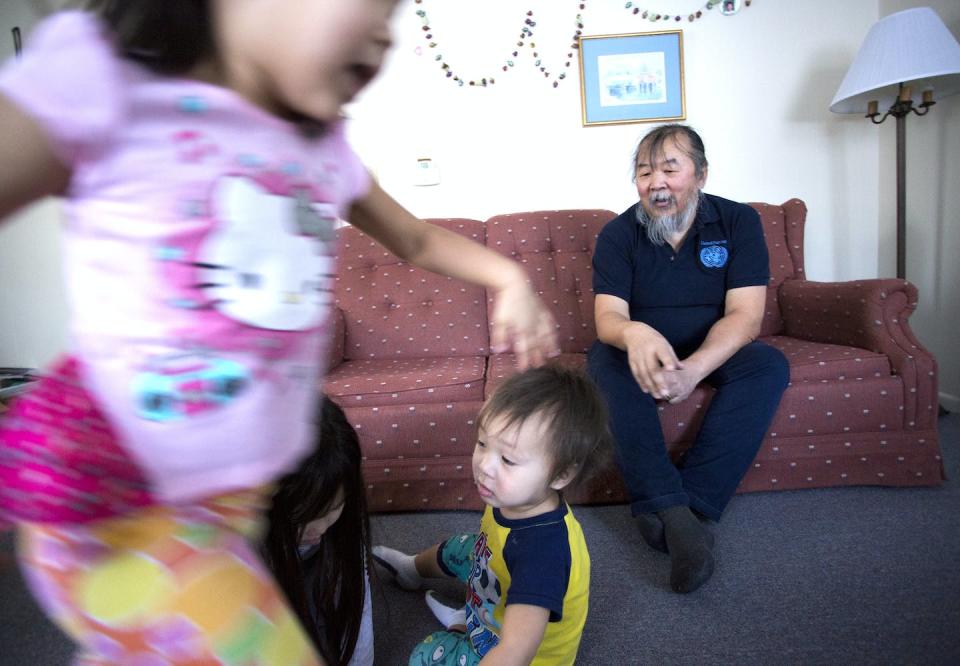 Pavel Sulyandziga watches his children play in his living room at home in Maine. <a href="https://www.gettyimages.com/detail/news-photo/pavel-sulyandziga-a-russian-indigenous-leader-is-filing-for-news-photo/669416920?adppopup=true" rel="nofollow noopener" target="_blank" data-ylk="slk:Staff photo by Derek Davis/Portland Press Herald via Getty Images;elm:context_link;itc:0;sec:content-canvas" class="link ">Staff photo by Derek Davis/Portland Press Herald via Getty Images</a>